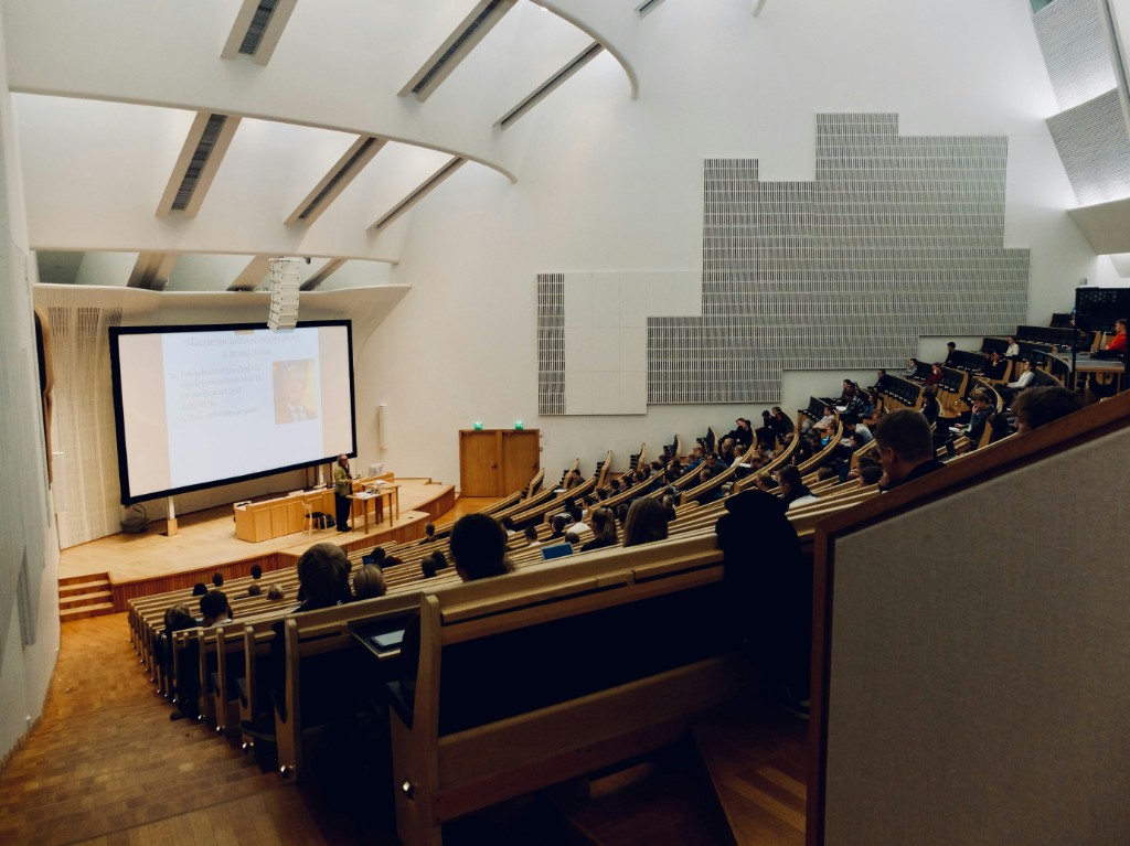 Students in a lecture hall during an academic presentation
